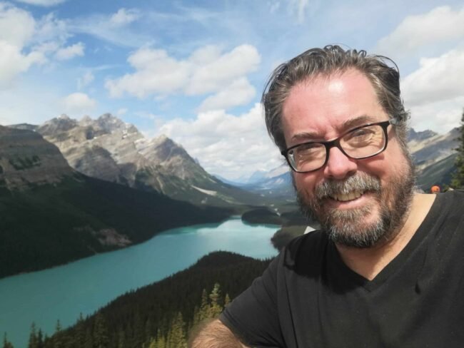 IMG_20250805_123855 (1) Author posting in front of Peyto Lake along the Icefields parkway.