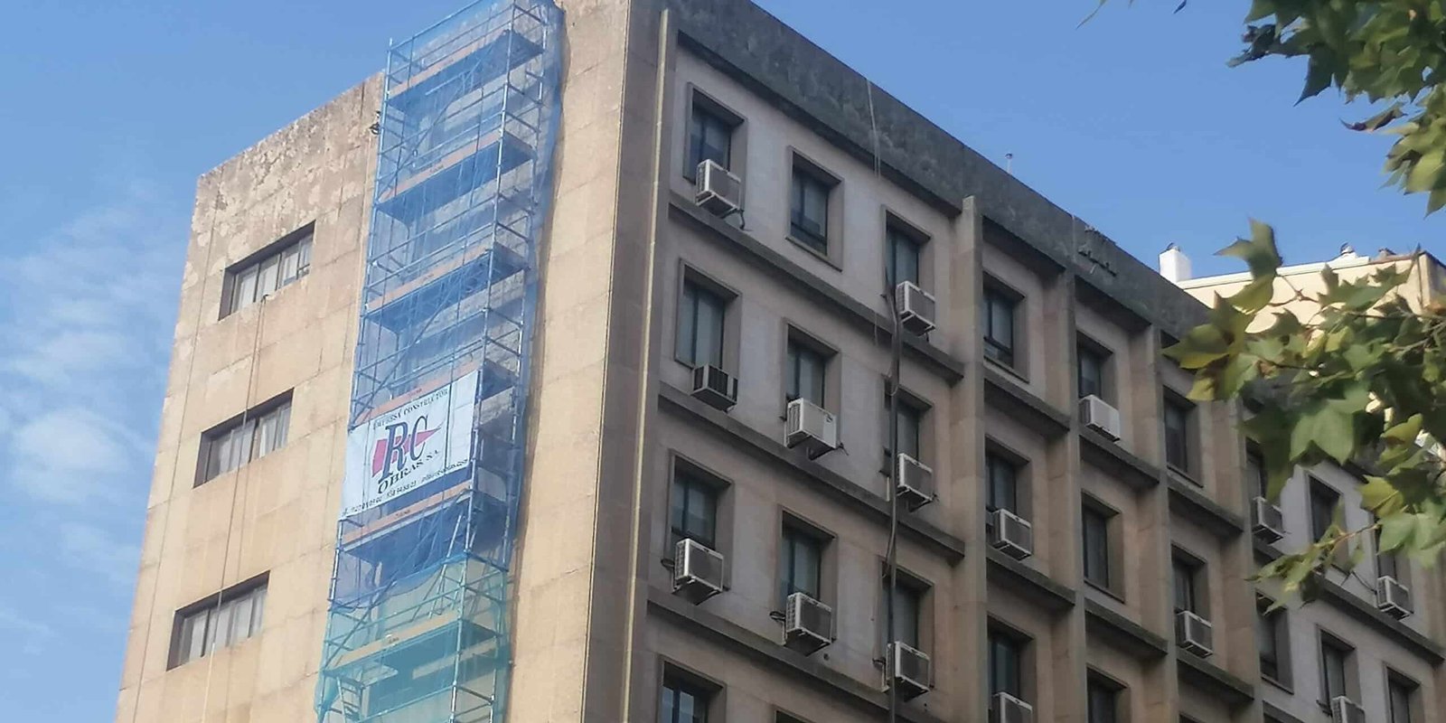 Scaffolding removing fasicst symbols from building in Caceres, Spain.